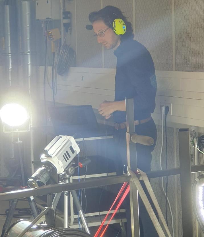 BMW motorcycle in professional testing facility with measurement equipment